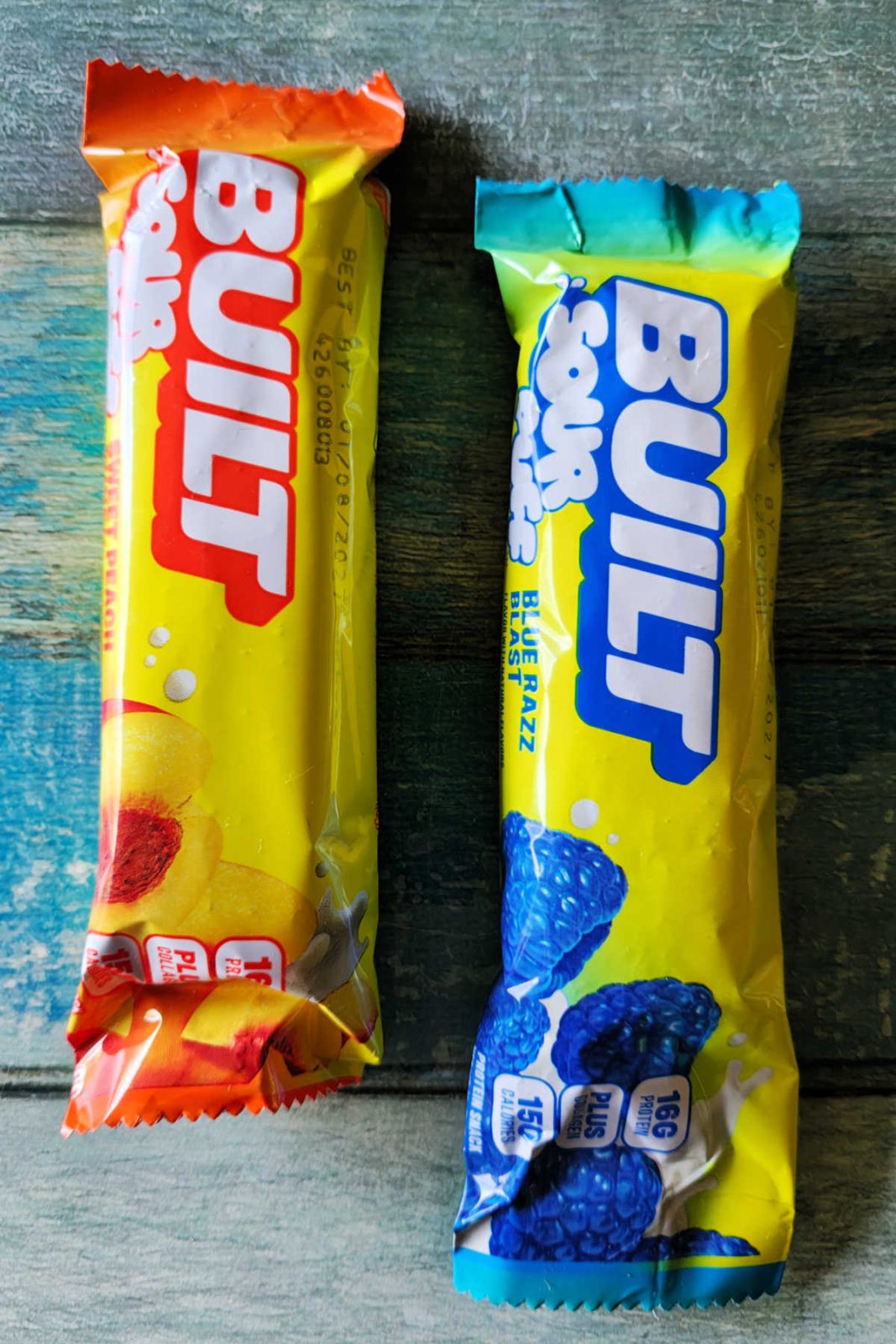 Built Sour Puff Protein Bars are a trendy, fun take on the popular Puff line. With 16g of protein, collagen peptides, and a marshmallow-like texture, these bars come in Green Apple Crush, Sweet Peach Punch, and Blue Razz Blast with no chalky aftertaste!