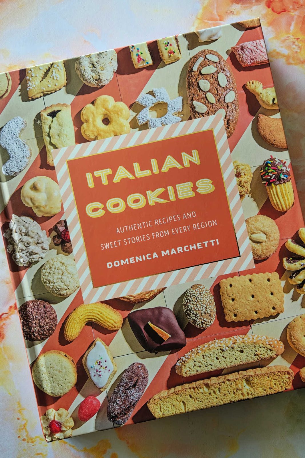 Bake your way through Italy with Italian Cookies! 🍋 This beautiful hardcover features authentic recipes, step-by-step instructions, and fascinating stories behind every regional treat. It's perfect for any home cook! 🍪