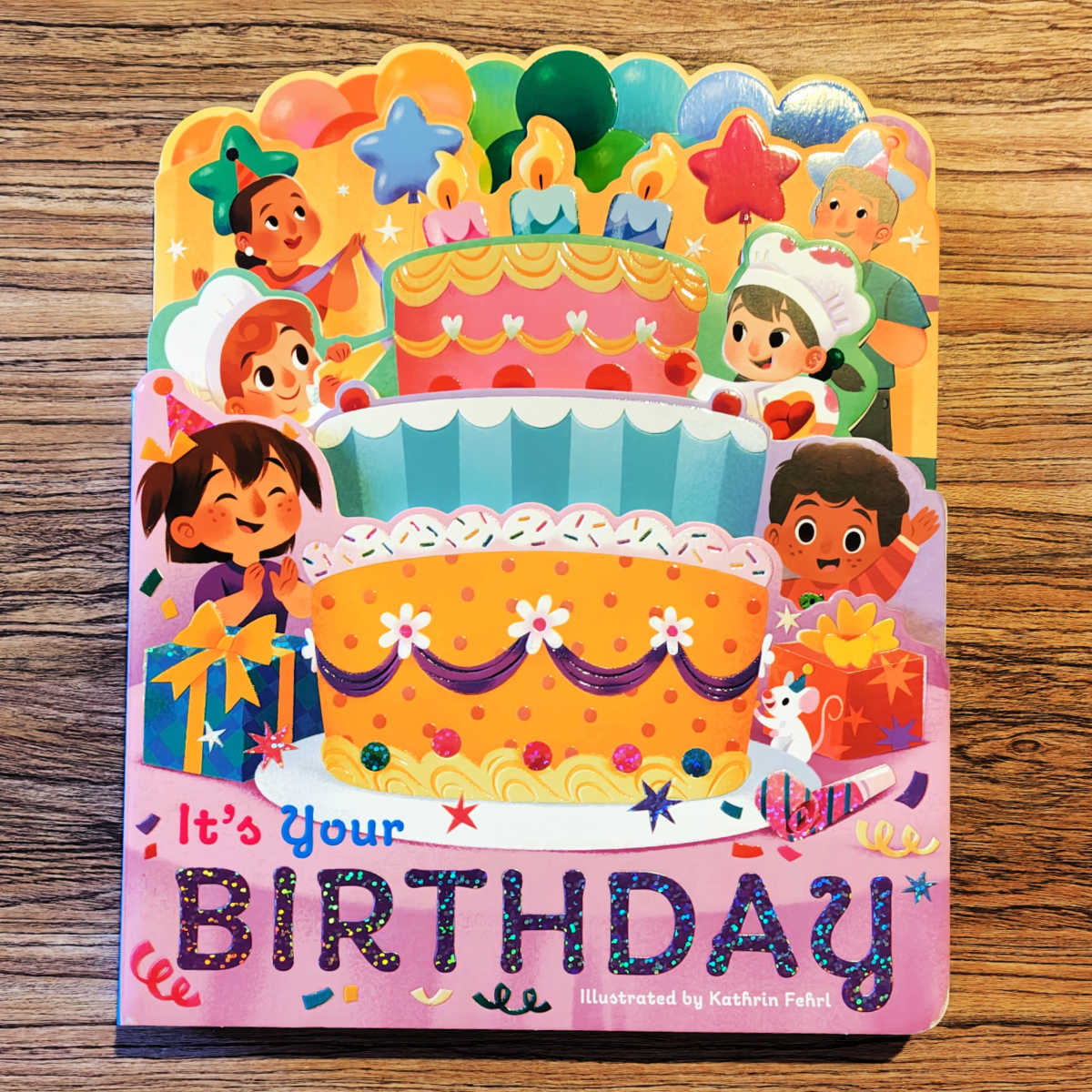 Celebrate the big day with It's Your Birthday! 🎈 This layered die-cut board book features super cute illustrations and engaging text that make it a good gift for little kids. ✨