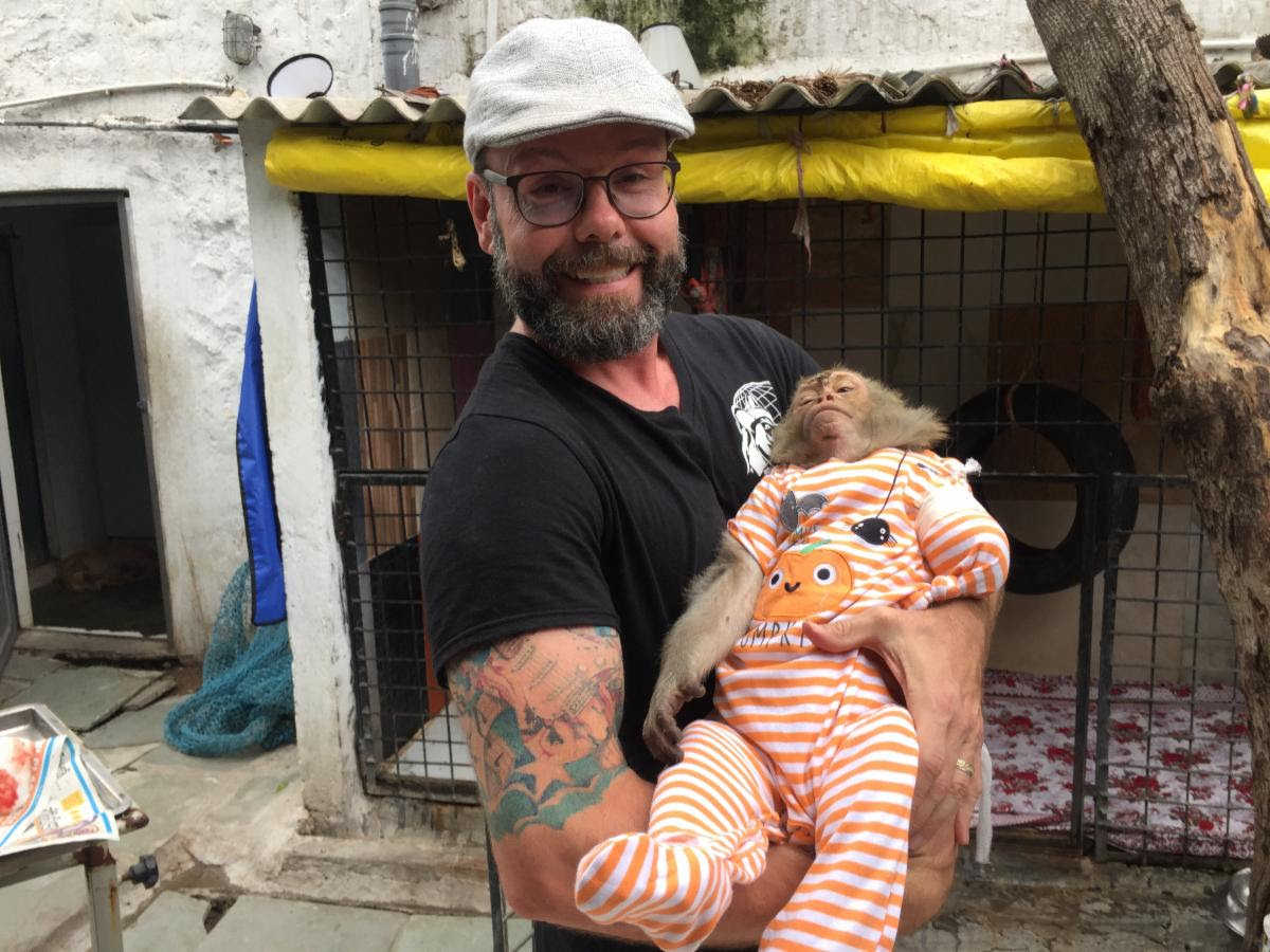 cliff holding monkey in pajamas