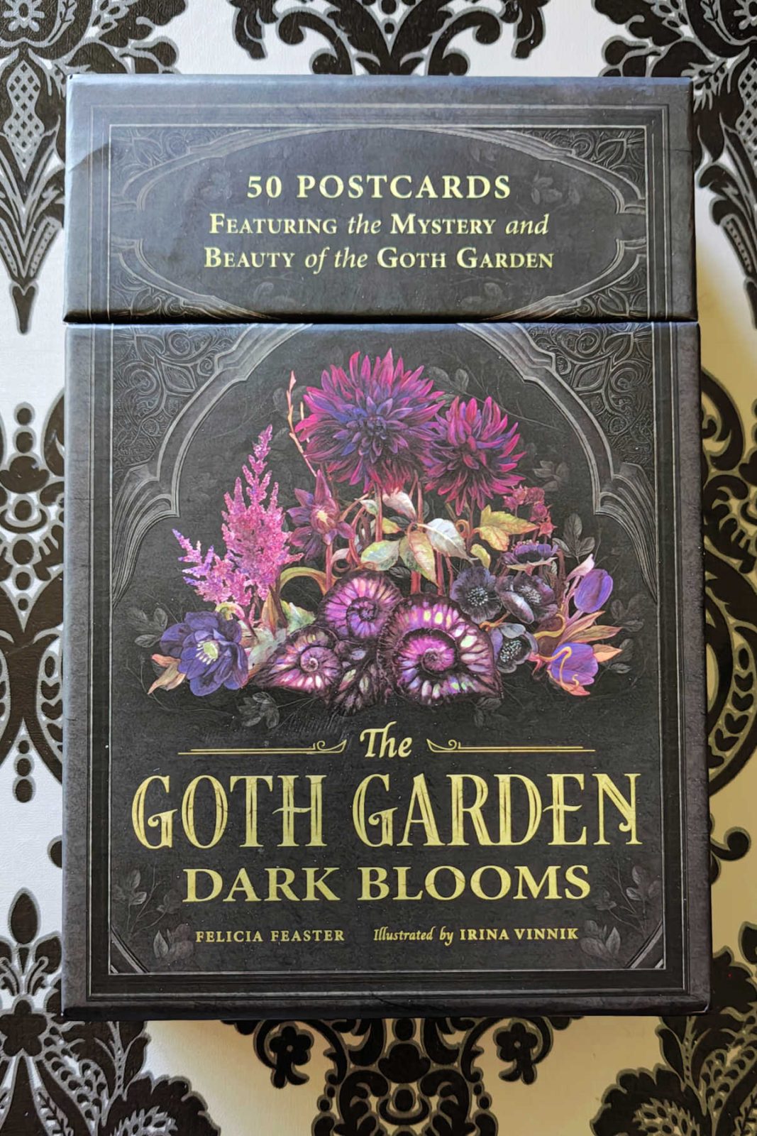This review of The Goth Garden Postcard Set highlights a beautiful boxed set of 50 high-quality, thick postcards. Discover how the stunning dark floral and gothic garden artwork makes a perfect gift for plant lovers
