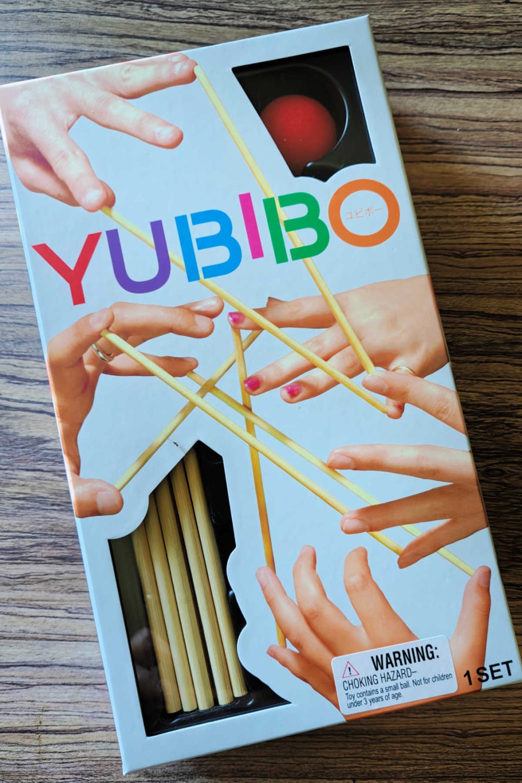 This review of Yubibo explores the viral Japanese balancing game that is perfect for family nights and parties. Discover why this easy-to-learn skill challenge for 2 to 8 players makes a fantastic addition to your summer vacation packing list.
