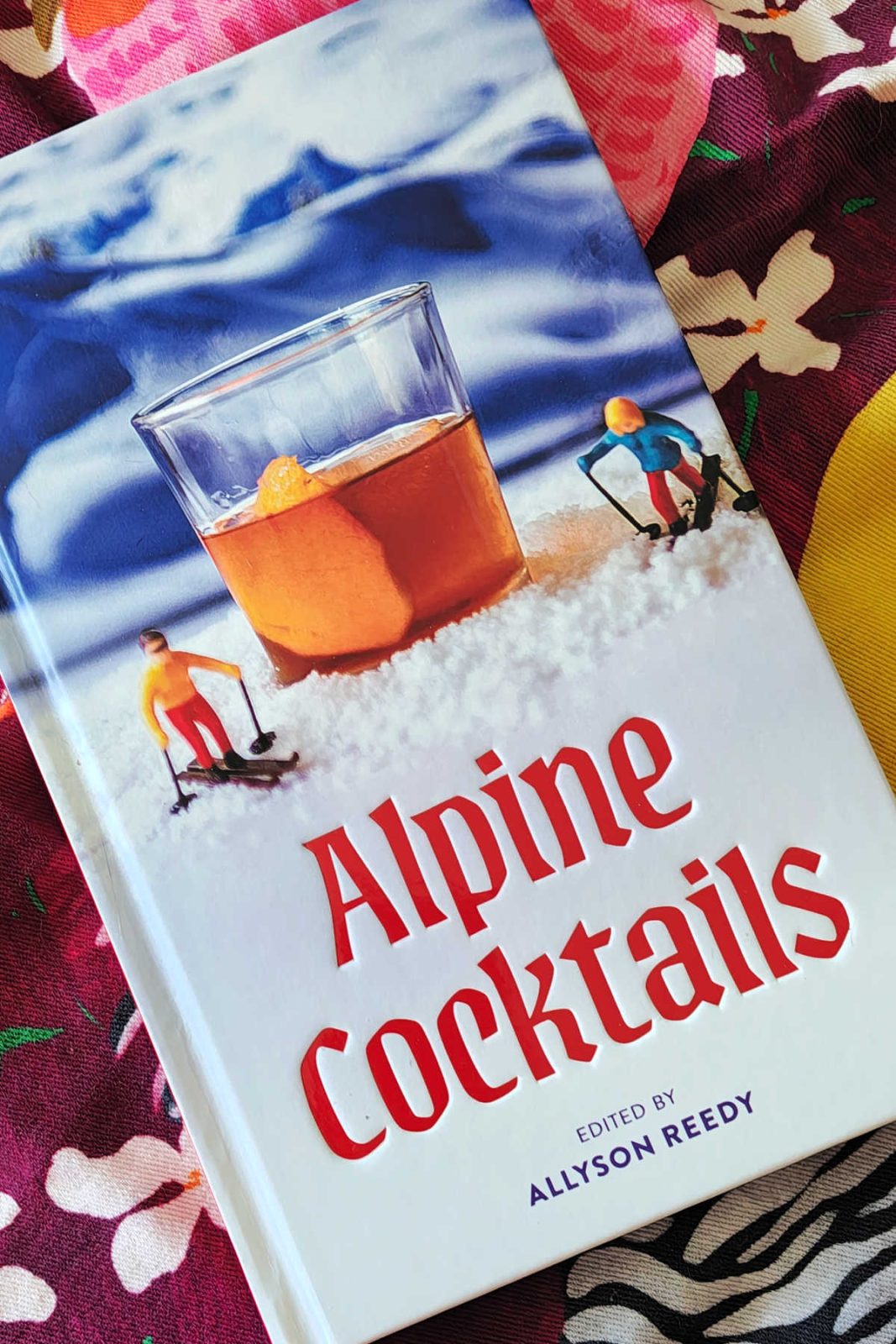 Alpine Cocktails: 75+ Recipes for Drinks and Small Bites for the Apres-Ski Life by Allyson Reedy is a fun and beautifully designed recipe book. Packed with clear instructions for both classics and unique cocktails, along with delicious small bites, it is a great size to keep with your bar supplies or give as a nice gift for a skier or mixologist!