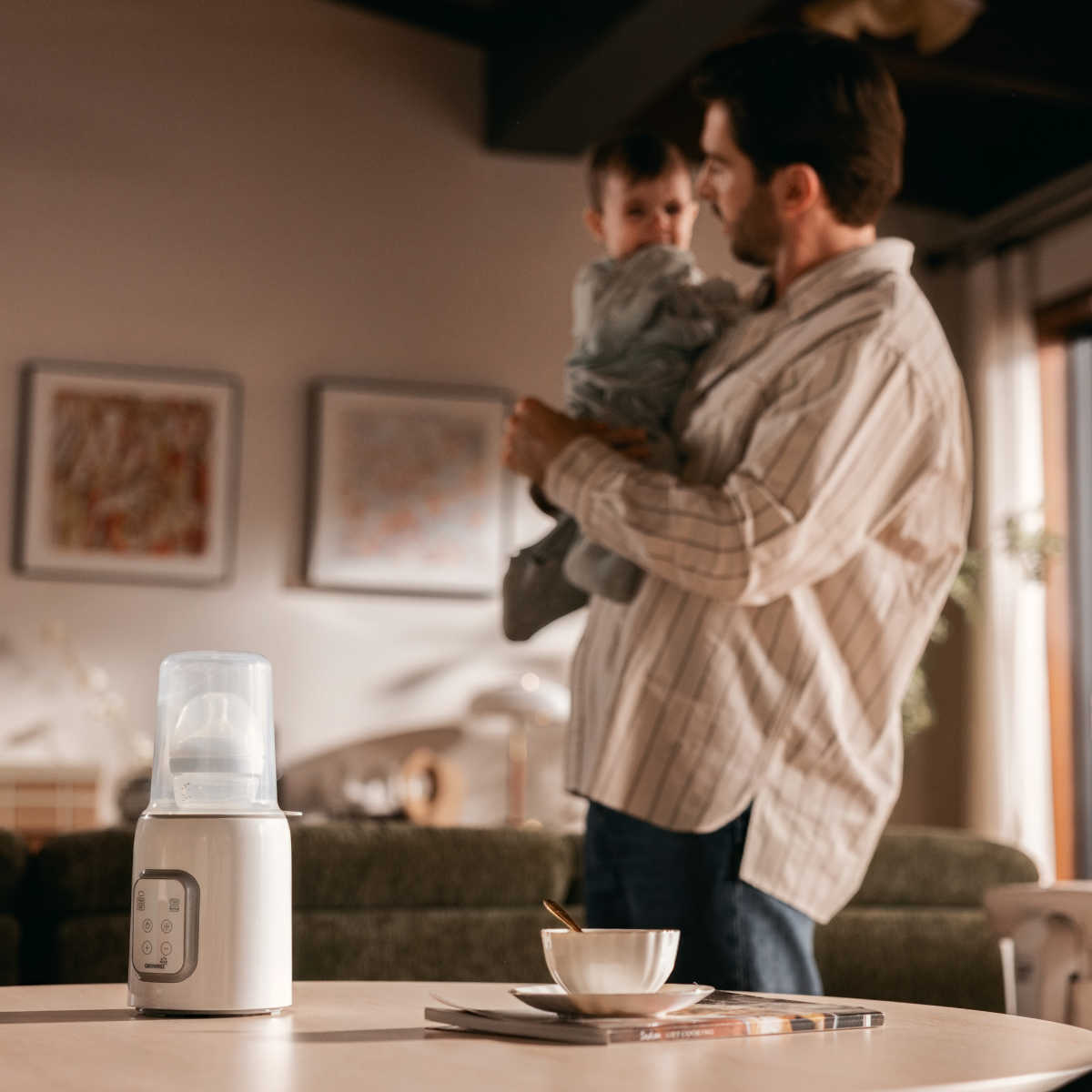 dad and baby with bottle warmer
