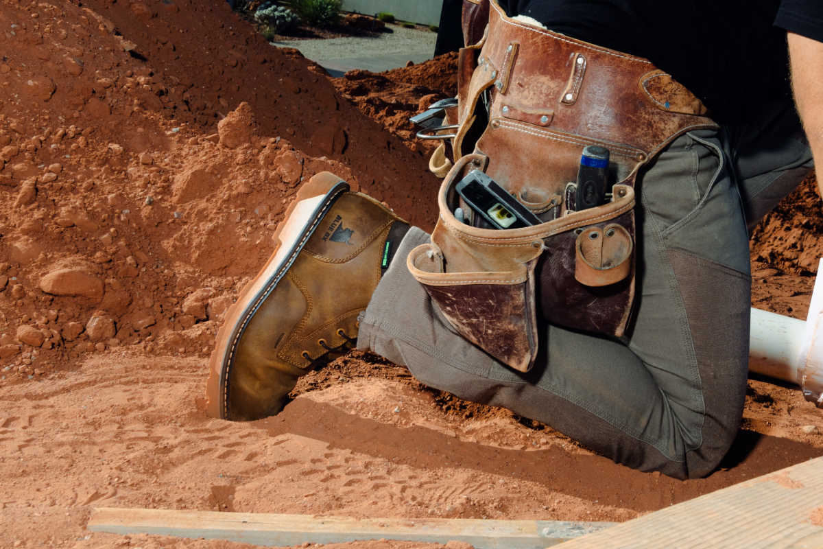construction worker wearing blue ox work boots